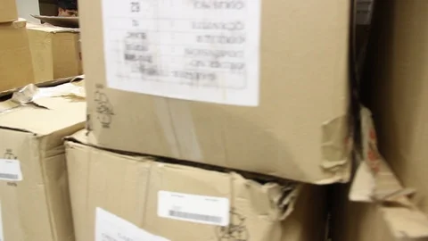 Cardboard box in a storage Stock Footage 125561777