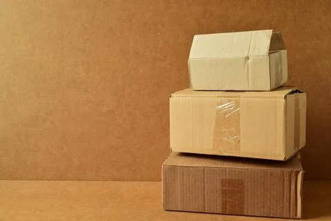 Cardboard boxes on a brown background Stock Photos