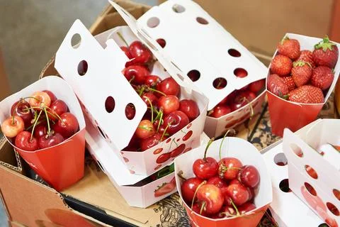 Cardboard boxes with cherries Stock Photos
