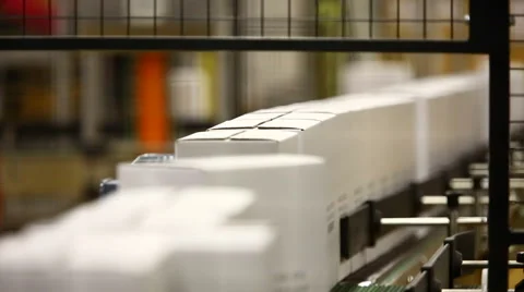 Cardboard boxes on a conveyor belt of a production line. Stock Footage