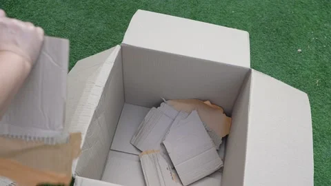 Cardboard boxes with crumpled paper inside for packaging goods. Stock Footage 230222790