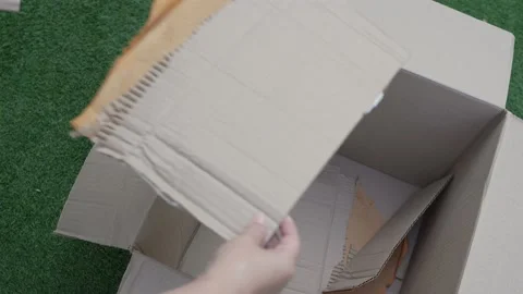 Cardboard boxes with crumpled paper inside for packaging goods. Stock Footage 230222807