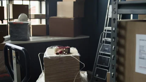 Cardboard Boxes with Delivery Labels Waiting in Warehouse Stock Footage 337307822
