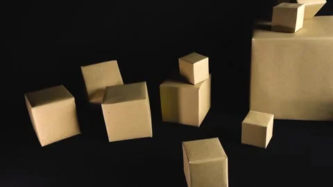 Cardboard boxes of different sizes moving on black background Stock Footage 341929962