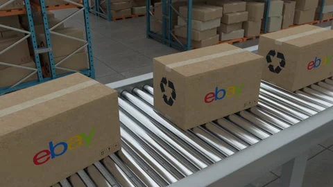 Cardboard boxes with Ebay Logo on conveyor belt line on warehouse background Stock Footage 230085432