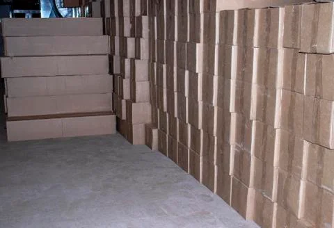 Cardboard boxes with goods in the basement. Stock Photos