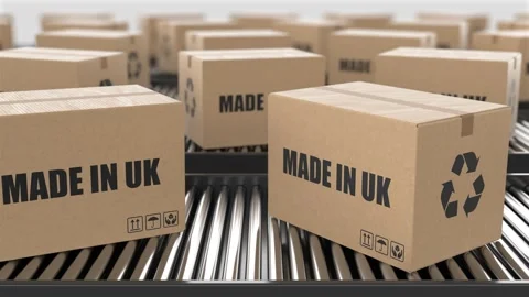 Cardboard boxes with Made in UK text on roller conveyor Stock Footage 262640709