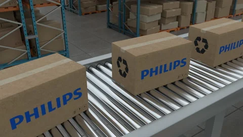 Cardboard boxes with Philips Logo on conveyor belt Stock Footage 230085597