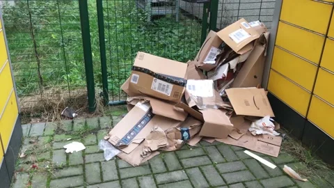 Cardboard boxes piling up infront of DHL Packstation in Berlin-Kreuzberg Video stock 132748030