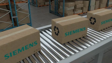 Cardboard boxes with Siemens Logo on conveyor belt on warehouse background. Stock Footage 230020060