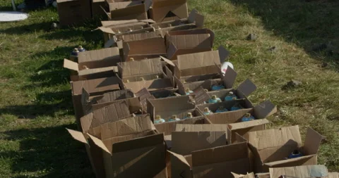Cardboard boxes with spray can paints on the ground Video stock 238857130