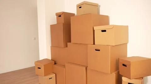 Cardboard boxes stacked in corner Stock Footage 342396993