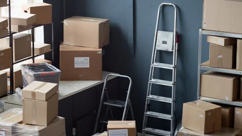 Cardboard Boxes Stacked in Warehouse for E-commerce Shipping Stock Footage 337308611