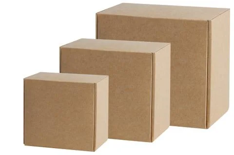 Cardboard boxes of various sizes are arranged in a row diagonally. Isolated o Stock Photos