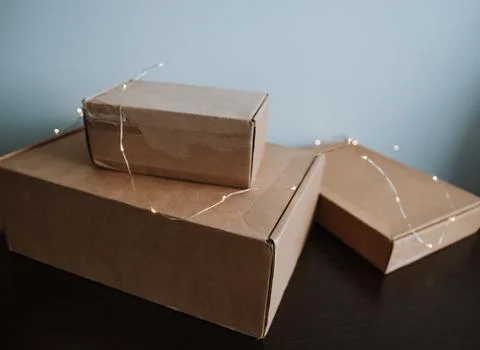 Cardboard boxes on a wooden table. 写真素材