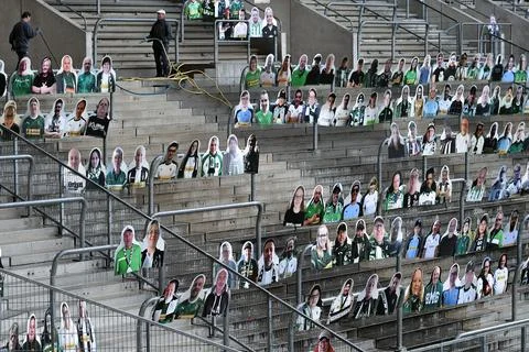 Cardboard cutouts replace supporters at empty soccer stadium in Germany, Moenche Stock Photos