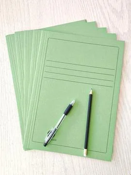 Cardboard document folder with pencil and pen 스톡 사진