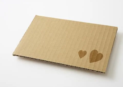 Cardboard with heart pattern Stock Photos