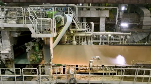 Cardboard making machine. Softwood pulp is fed into the cardboard making machine Stock Footage 326162953