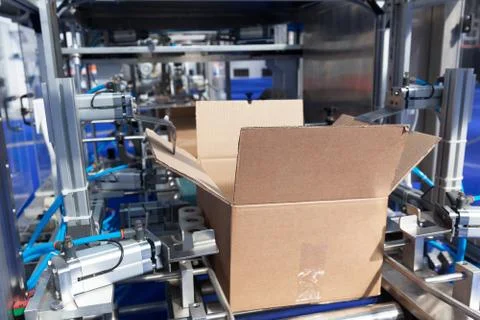 Cardboard package box packing machine Stock Photos