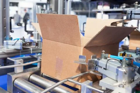 Cardboard package box packing machine Stock Photos