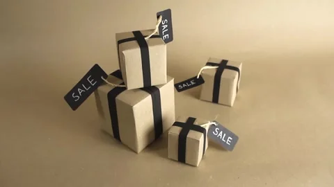 Cardboard paper gift boxes with black ribbons and sale tags Video stock 341324162