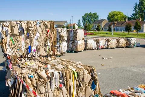 Cardboard pressed into rows for further processing recycling Stock Photos