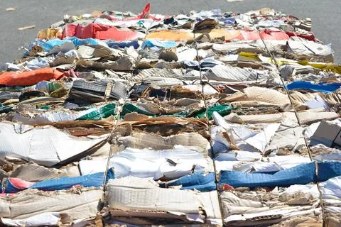 Cardboard pressed into rows for further processing recycling Stock-Fotos