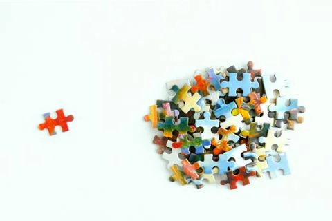 Cardboard puzzles with a pattern on a white background. Close-up. View from a Stock Photos