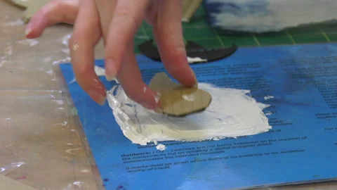 Cardboard shape being placed in paint 動画素材 239654078