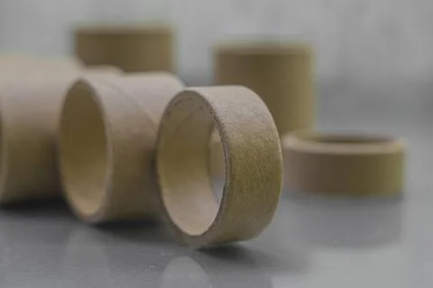 Cardboard spools for winding. Reels made of cardboard. Background of cardboard Stock Photos