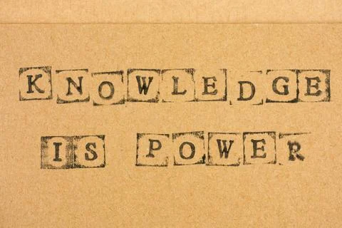 Cardboard with words Knowledge is Power Stock Photos