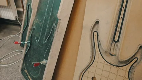 Cardboards frames of the guitar at the workshop Stock Footage 274764673