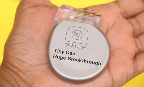 Cardiac re-synchronization therapy device with CRT-P) placed on palm. Stock Photos