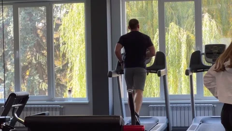 Cardio on a treadmill in the gym Stock Footage 219747408