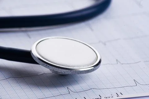 Cardiogram with stethoscope on table, closeup Stock Photos