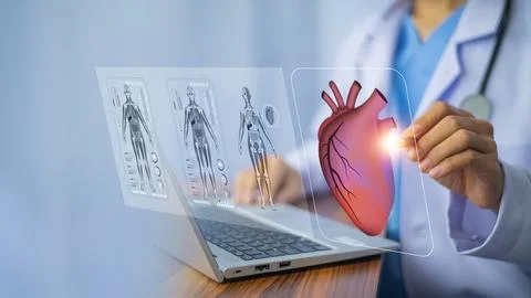 Cardiologist doctor using computer visual screen learning data for treatmen.. Stock Photos