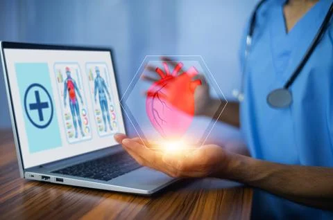 Cardiologist doctor using computer visual screen learning data for treatmen.. Stock Photos
