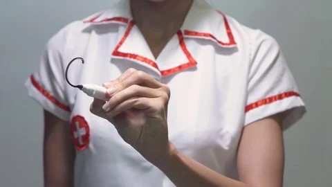 CARDIOLOGY, Female doctor writing on transparent screen Stock Footage