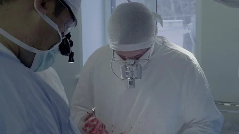 Cardiosurgeons perform a cut with the help of a coagulator. Aorto-coronary Stock Footage 104920140