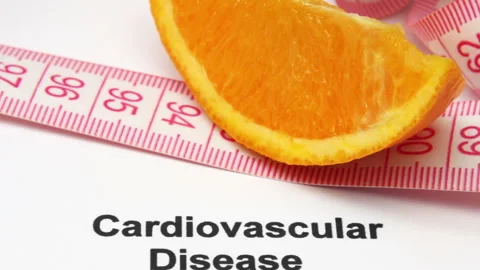 Cardiovascular Disease Risk Concept with Measuring Tape and Health Document Stock Footage 337971540