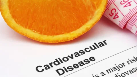 Cardiovascular Disease Risk Concept with Measuring Tape and Health Document Stock Footage 339633415