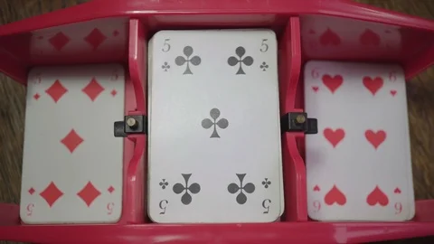 Cards are mixed and distributed with a mixing machine, numbers on top Stock Footage 98448262