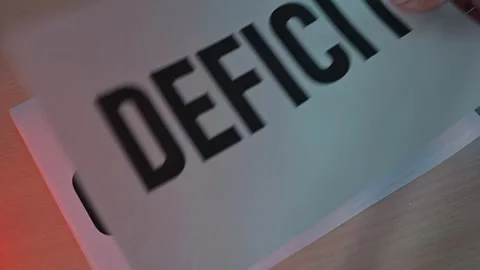Cards displaying key economic concepts such as debt, deficit, risk, and Stock-Footage 338188255