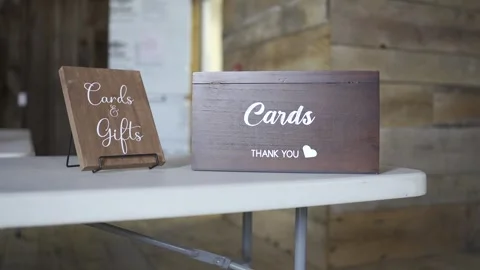Cards &amp; gift wooden boxes  placed on top of a table Stock Footage 304985261