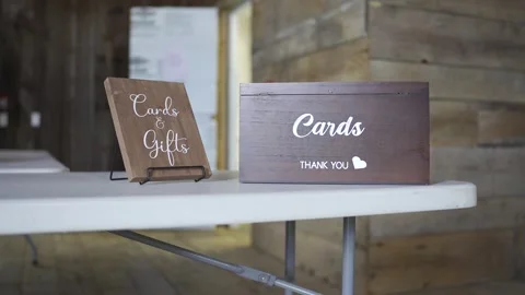 Cards &amp; gift wooden boxes  placed on top of a table Stock-Footage 304985296