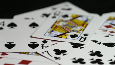 Cards hitting table Stock Footage 10738907