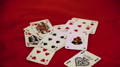 Cards thrown in a red table Stock Footage 63175217