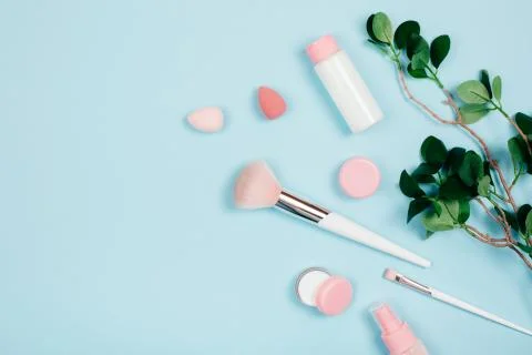 Care cosmetics on green background Stock Photos