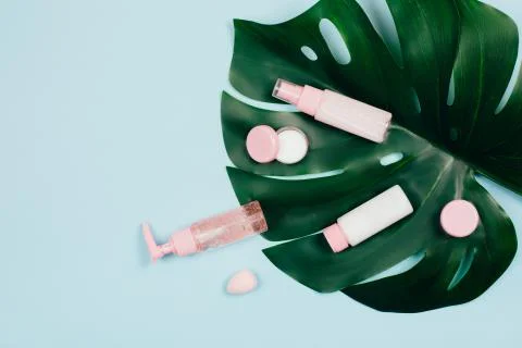 Care cosmetics on green background Foto stock
